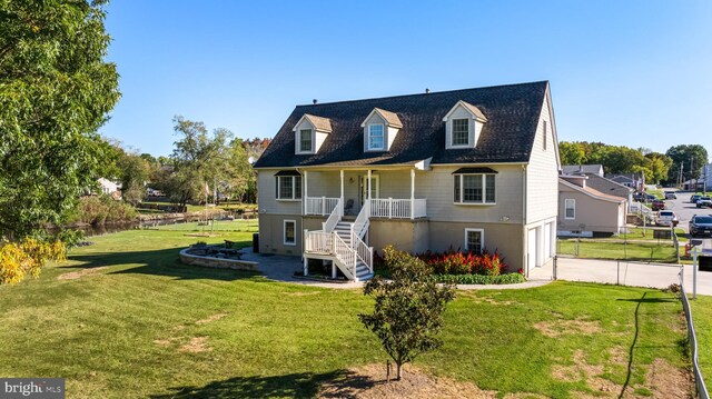 view of front of house with a front lawn and a porch