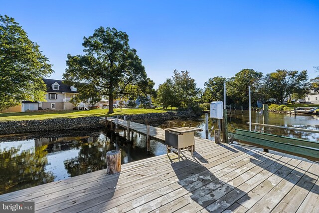 view of dock with a water view