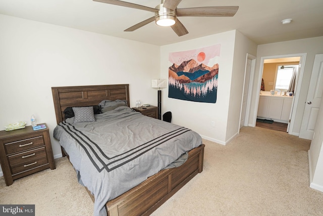 carpeted bedroom featuring connected bathroom and ceiling fan