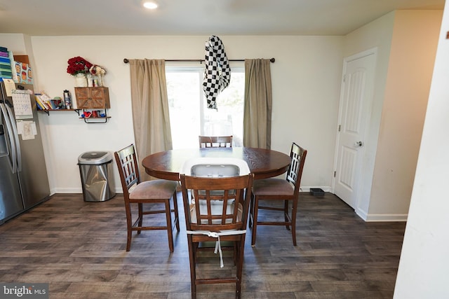 dining space featuring dark hardwood / wood-style floors