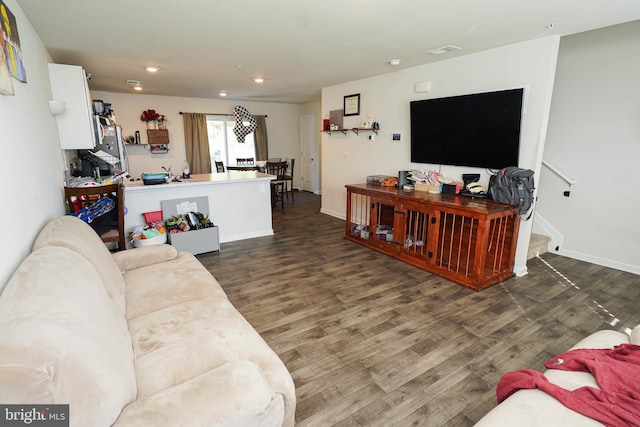 living room featuring dark wood-type flooring