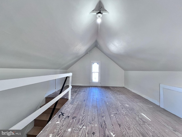 bonus room featuring lofted ceiling and hardwood / wood-style flooring