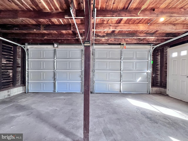 garage with wooden ceiling and a garage door opener