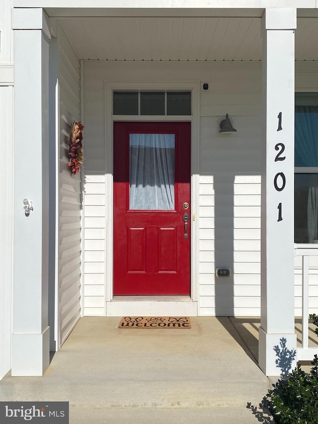 doorway to property with a porch