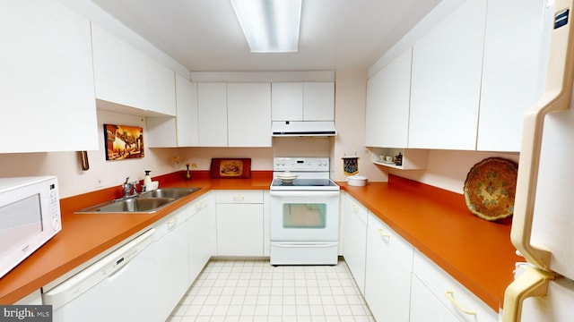 kitchen featuring sink, white cabinets, and white appliances