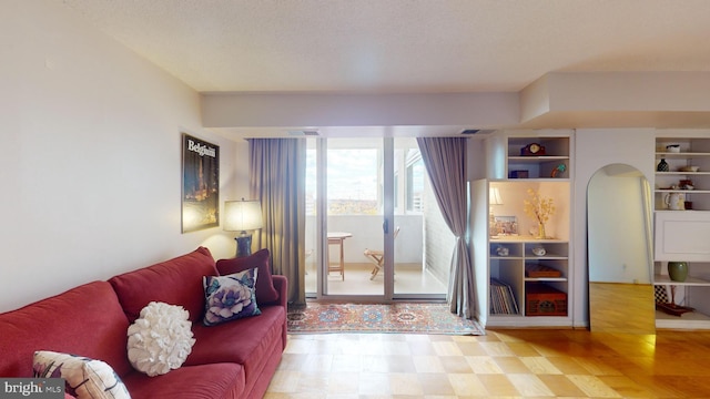 living room featuring a textured ceiling