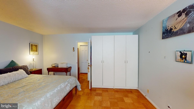 bedroom featuring a textured ceiling