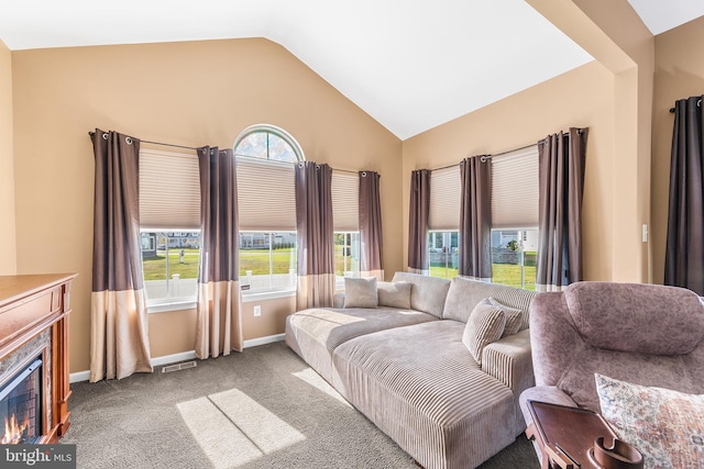 living room featuring vaulted ceiling and light colored carpet