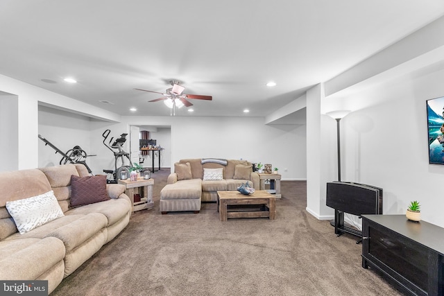 living room featuring carpet floors and ceiling fan