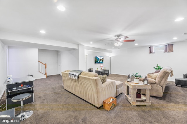 living room featuring ceiling fan and carpet flooring