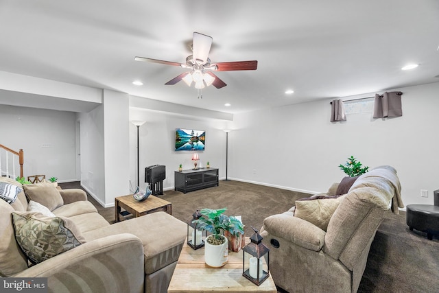 living room with ceiling fan and carpet floors