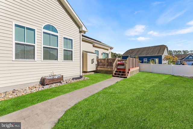 view of yard featuring a deck