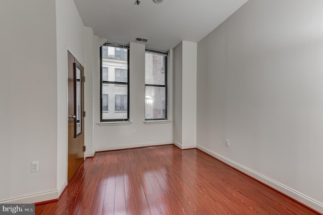 spare room featuring light hardwood / wood-style floors