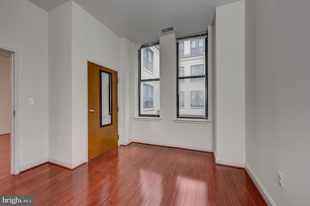 empty room featuring hardwood / wood-style floors