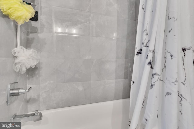 bathroom featuring shower / bath combination with curtain