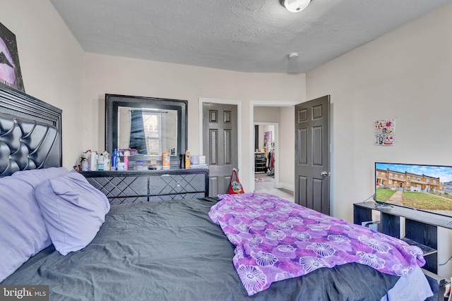 bedroom featuring a textured ceiling