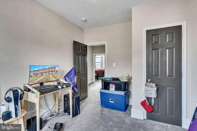 office featuring carpet and a textured ceiling