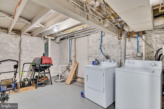 washroom featuring washing machine and dryer and electric panel