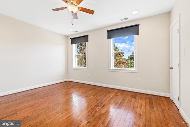 spare room featuring ceiling fan and hardwood / wood-style floors