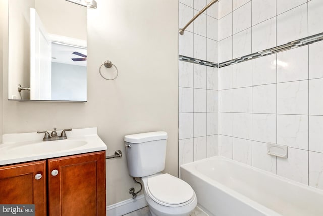 full bathroom with toilet, tiled shower / bath, and vanity