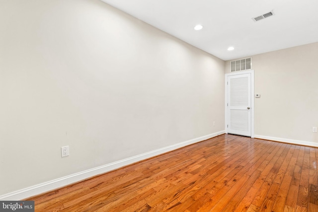 spare room with wood-type flooring