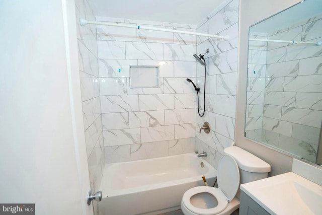 full bathroom featuring vanity, toilet, and tiled shower / bath