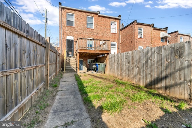 back of house featuring a deck