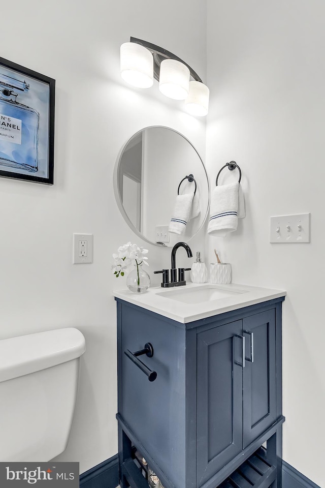 bathroom with vanity and toilet