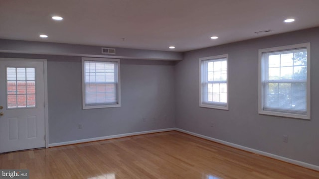 unfurnished room featuring light wood-type flooring