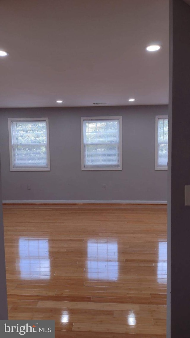 empty room with light wood-type flooring