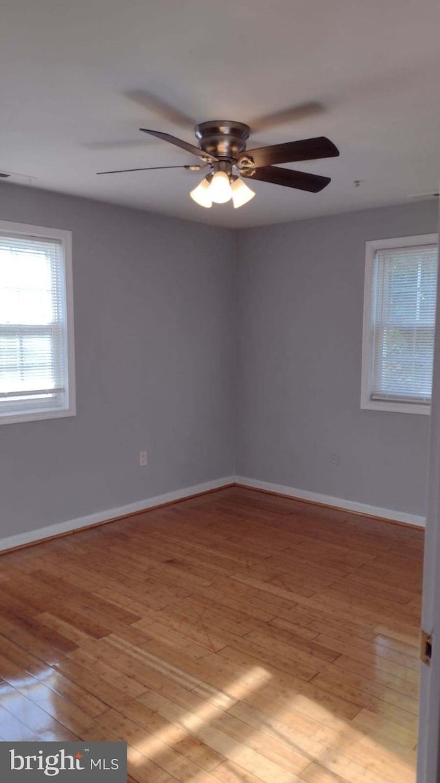 spare room with light hardwood / wood-style floors