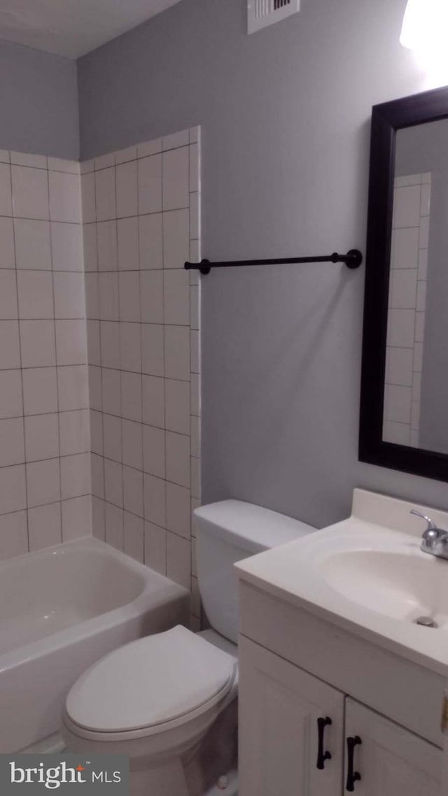 full bathroom featuring toilet, shower / washtub combination, and vanity