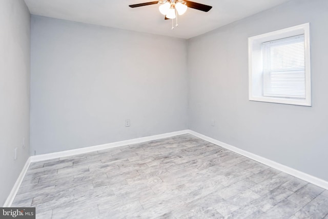 empty room featuring ceiling fan and light hardwood / wood-style flooring