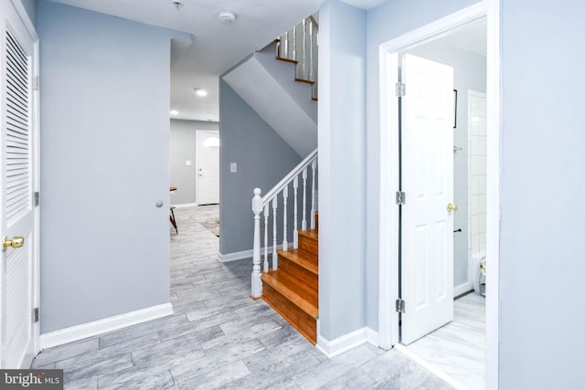 stairway with wood-type flooring