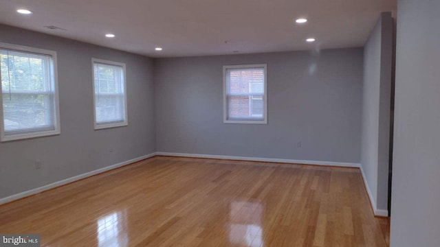 spare room featuring light hardwood / wood-style flooring