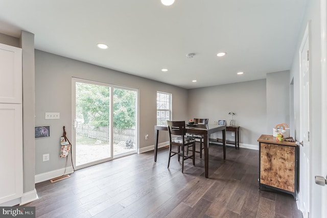 dining space featuring dark hardwood / wood-style flooring