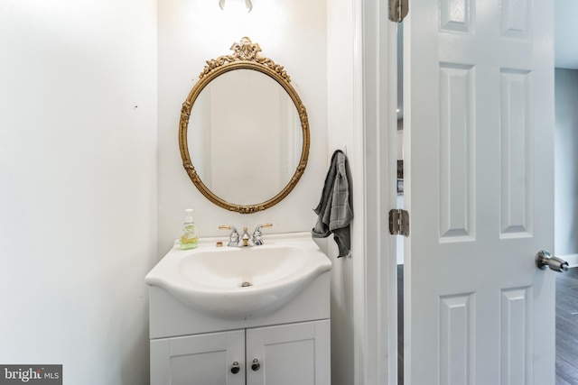 bathroom featuring vanity and hardwood / wood-style flooring