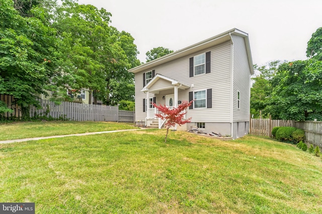 view of front of home featuring a front yard