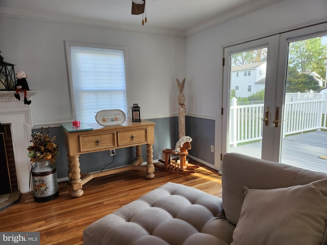 living room with french doors, ceiling fan, crown molding, and hardwood / wood-style floors