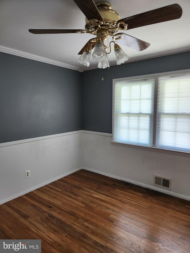 unfurnished room with crown molding, ceiling fan, and dark hardwood / wood-style floors