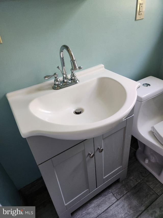 bathroom with vanity and toilet