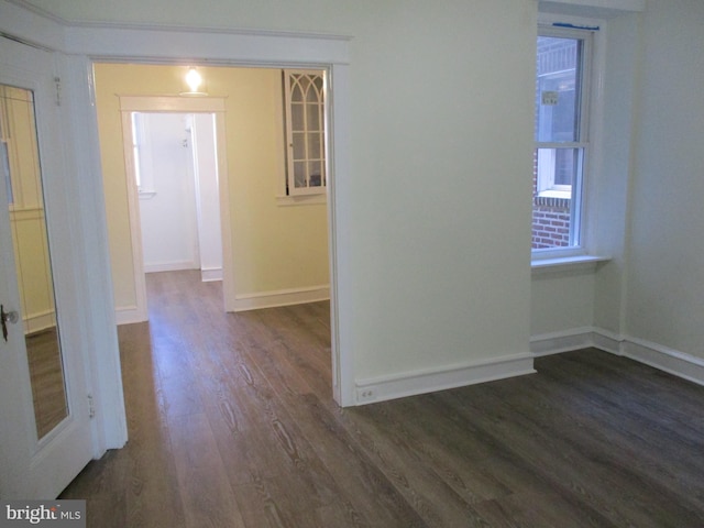 empty room featuring dark wood-type flooring