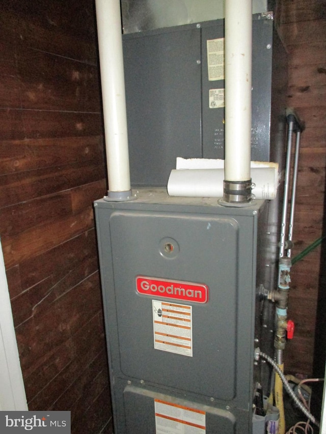 utility room with heating unit