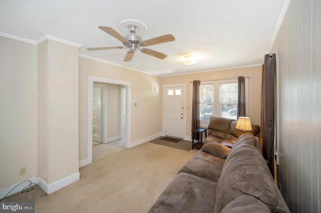 living room with ceiling fan, light colored carpet, and ornamental molding