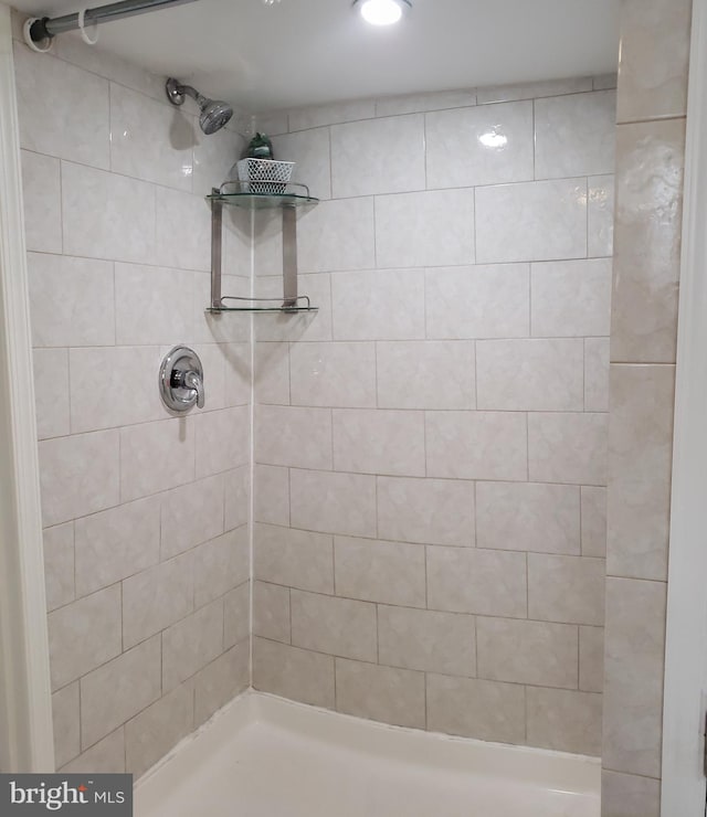 bathroom with tiled shower