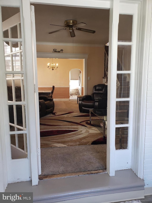 doorway to property with ceiling fan