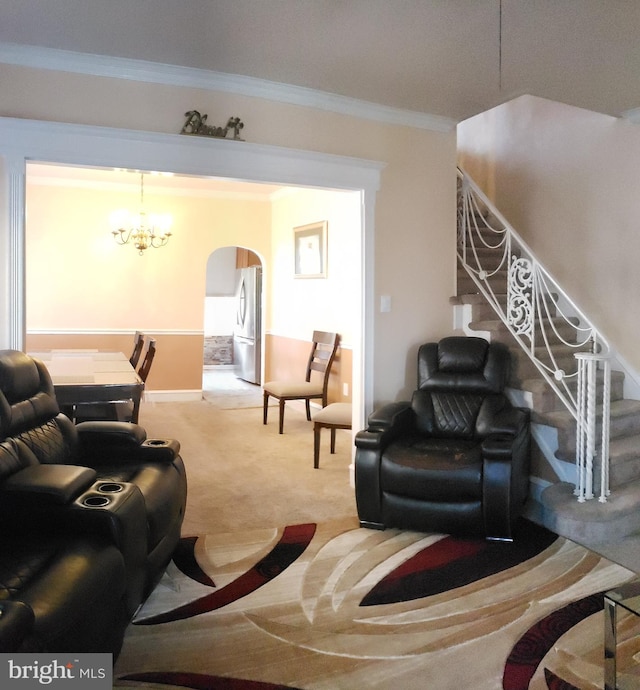 carpeted living room featuring washer / clothes dryer, crown molding, and a notable chandelier