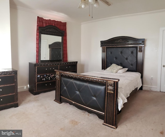 bedroom featuring ceiling fan, ornamental molding, and light carpet