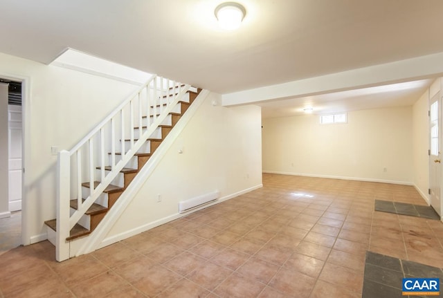 basement featuring light tile patterned flooring