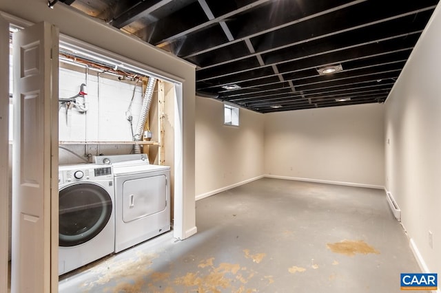 laundry area featuring separate washer and dryer and a baseboard radiator